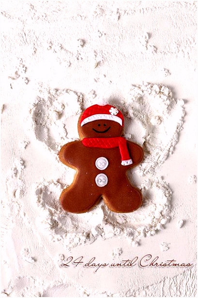 1 25 Gingerbread man is making a snow angel